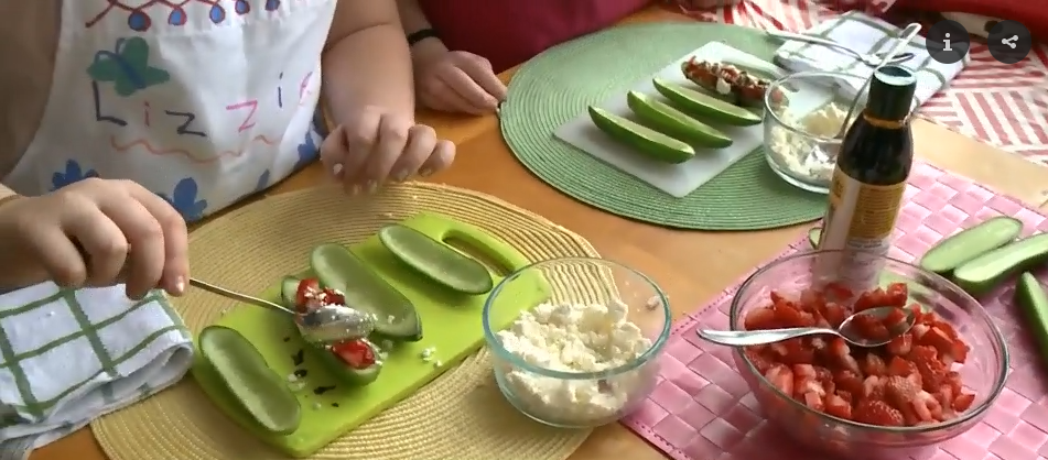 Kids making Strawberry Cucumber Boats recipe